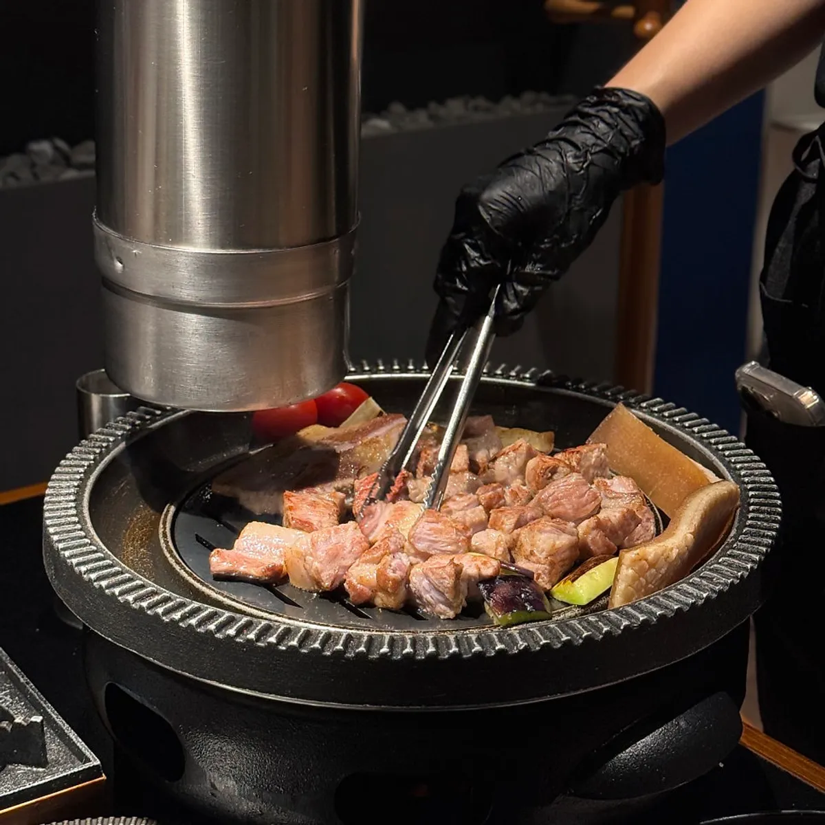 Whole pork belly and whole pork neck grilling on the pan