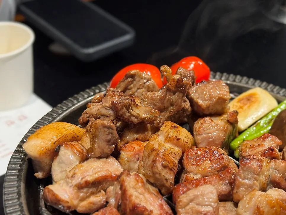 Meat dipped in cheese fondue sauce