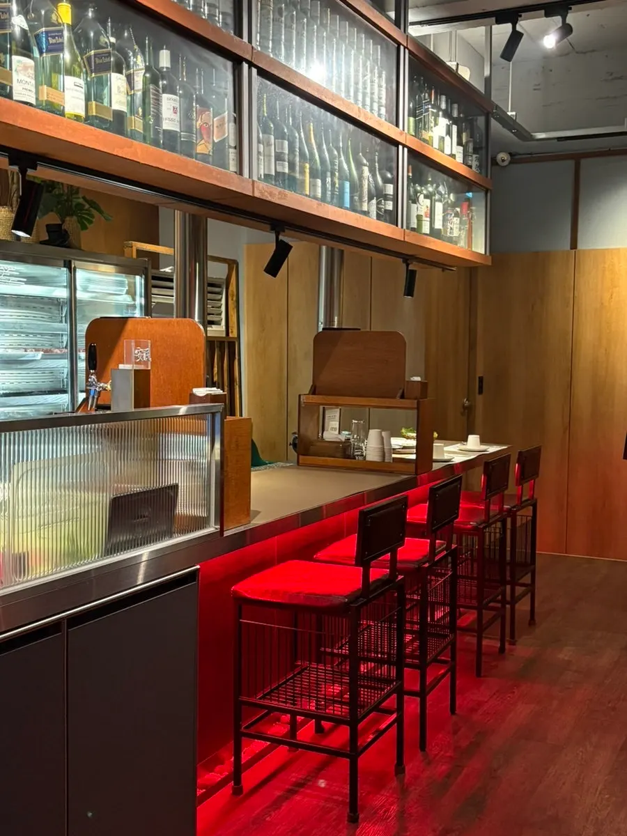Interior of Anmin Jinhae with wood tones and red accents
