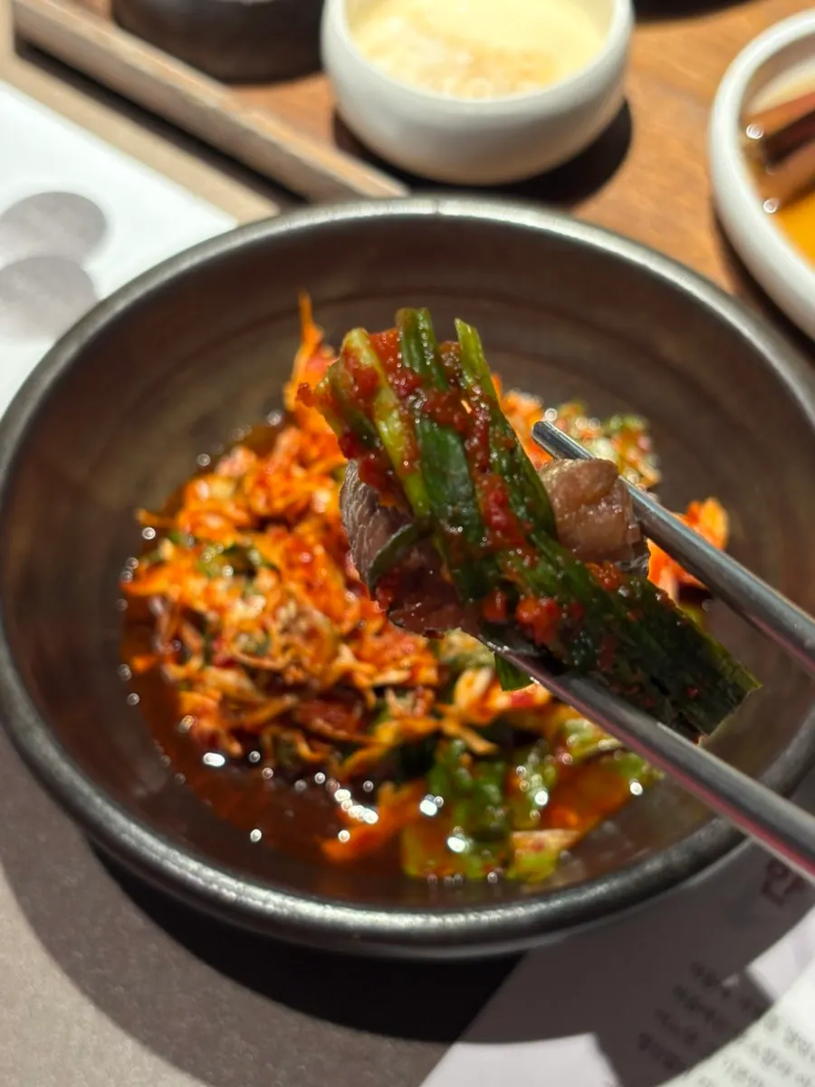 Meat topped with scallion shreds and special soy sauce