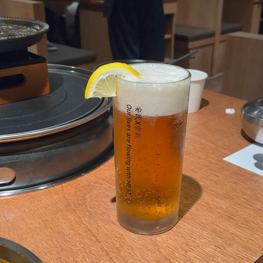 A frothy glass of creamy draft beer at Anmin Jung-dong