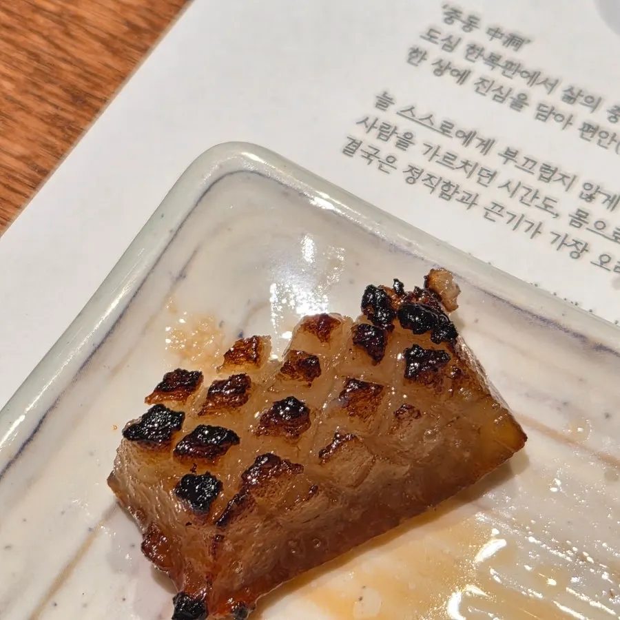 Thick pork skin grilling on the charcoal grill