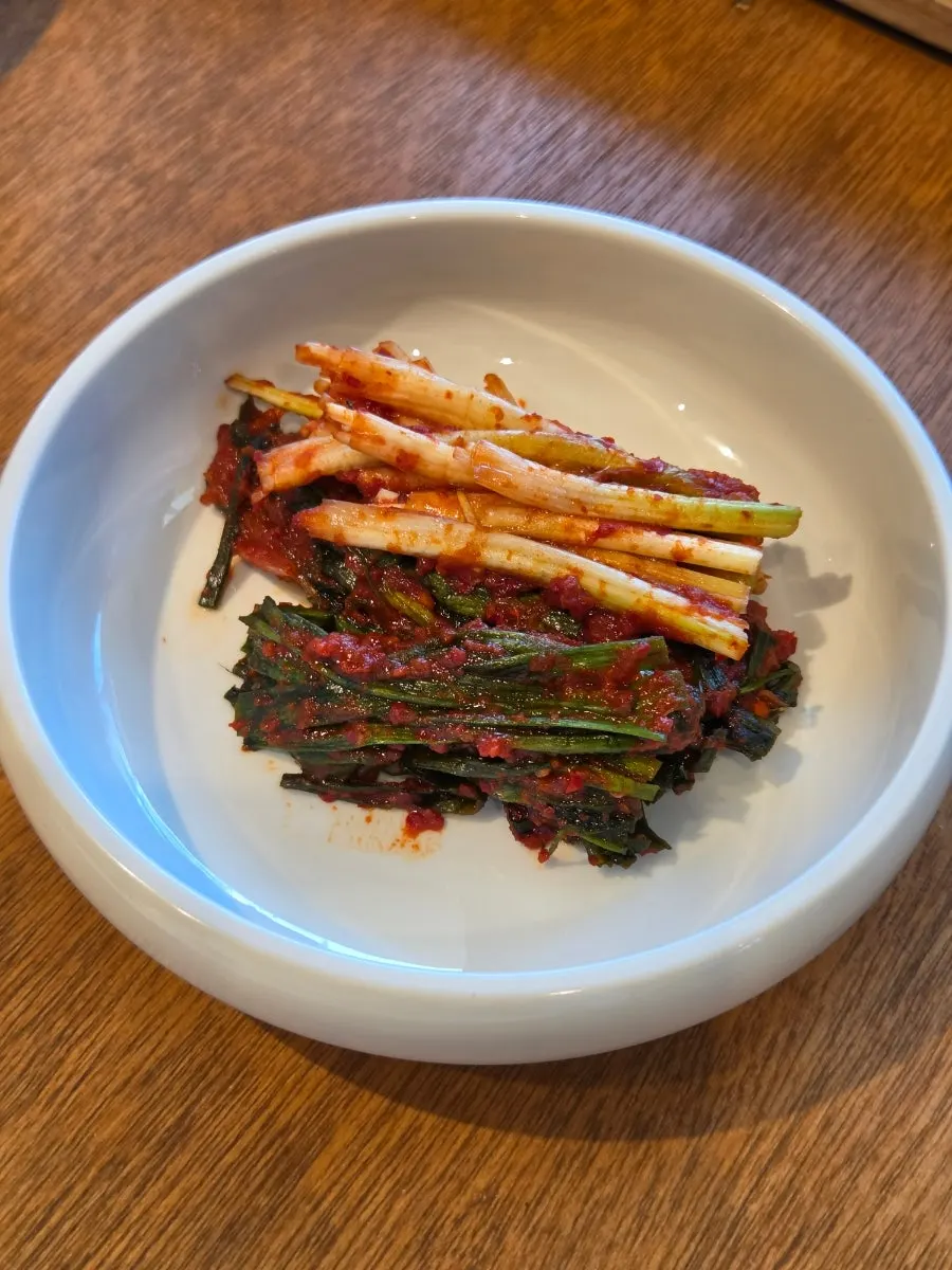 Side dishes at Anmin Yangsan including pine mushroom wasabi and hairtail jeotgal