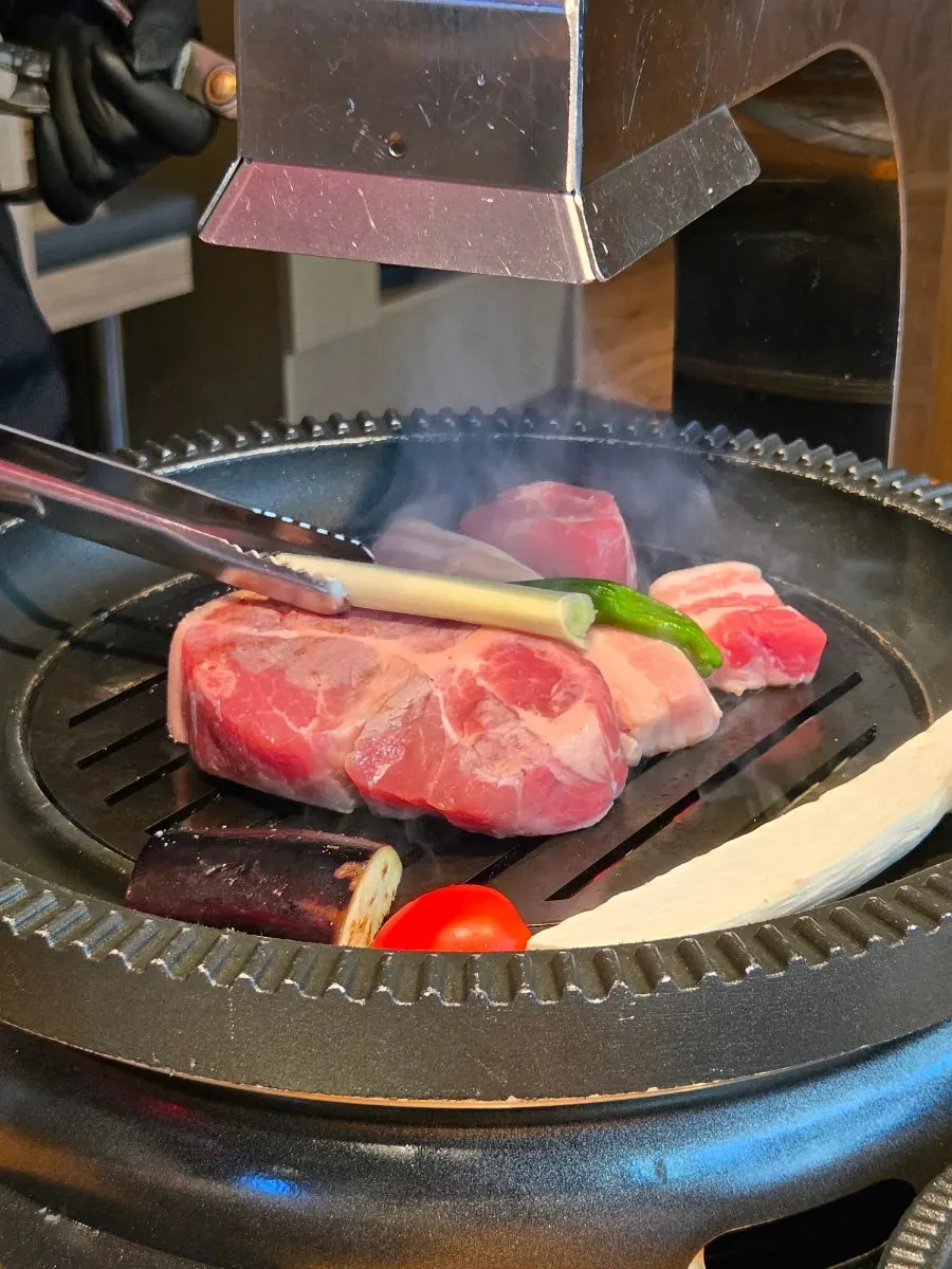 Pork belly and vegetables on the grill