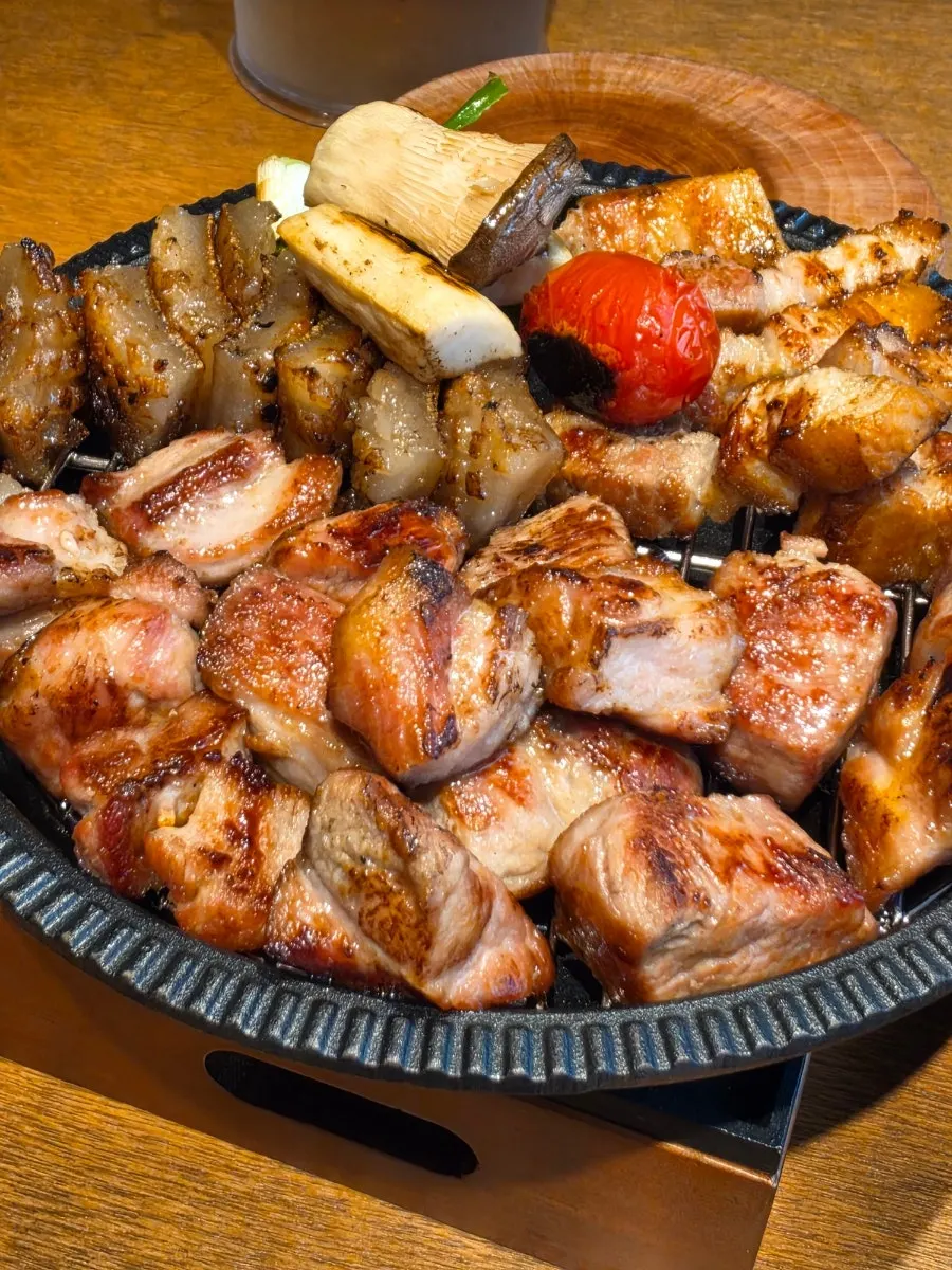Grilled meat on a wrap vegetable with sides