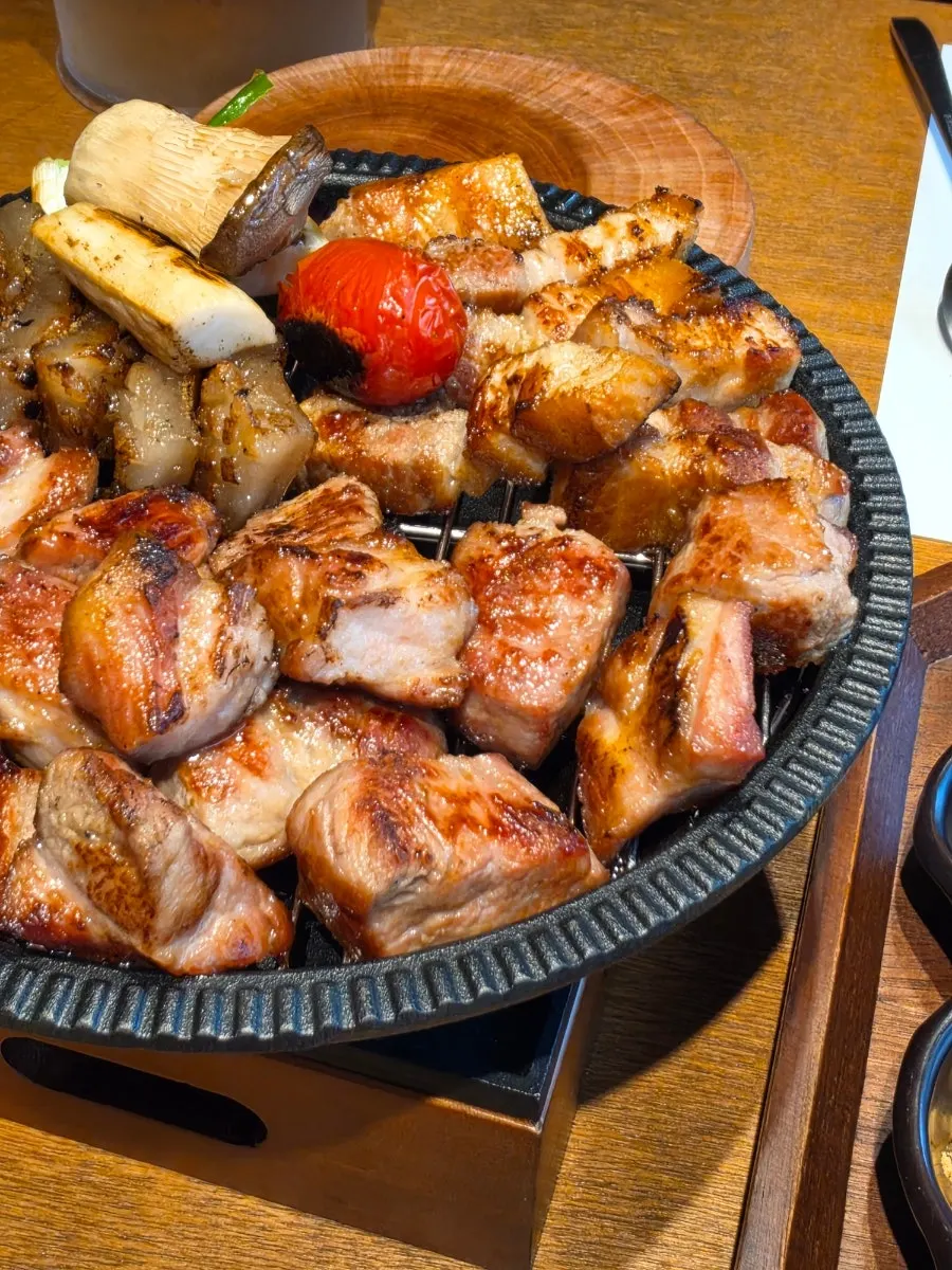 Plate of fully cooked half-pig BBQ set meat