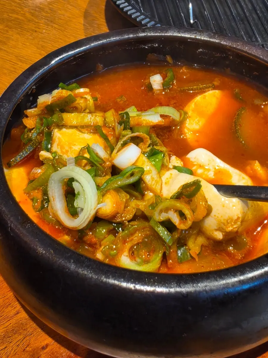 A spoonful of sundubu jjigae broth