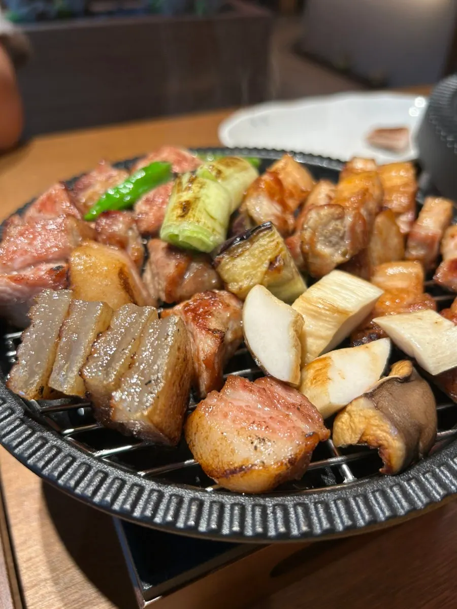 Plate of meat kept warm over a low flame