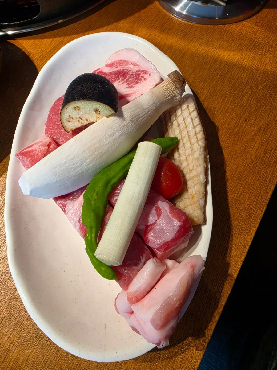 Plate of samgyeopsal, pork neck, and pork belly skin