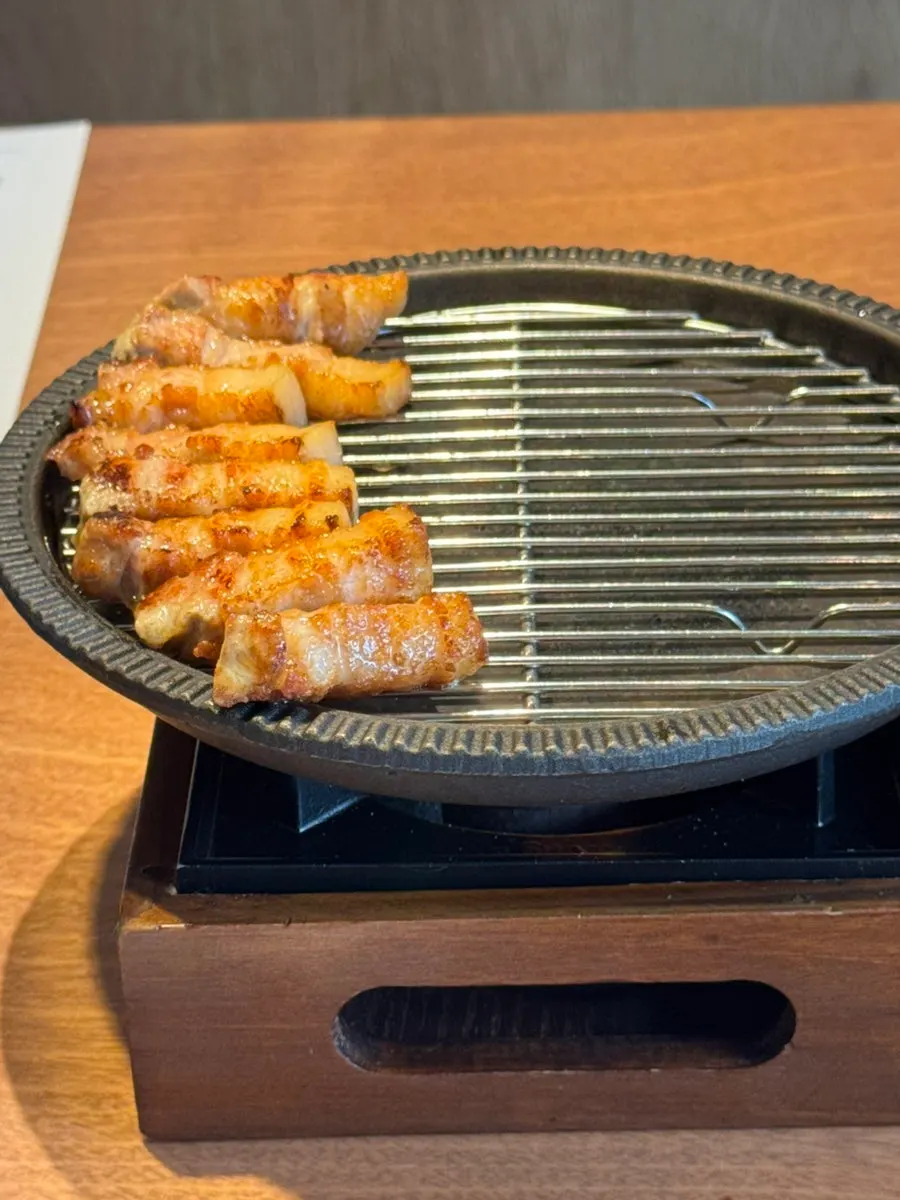 Grilled pork belly placed on the brazier