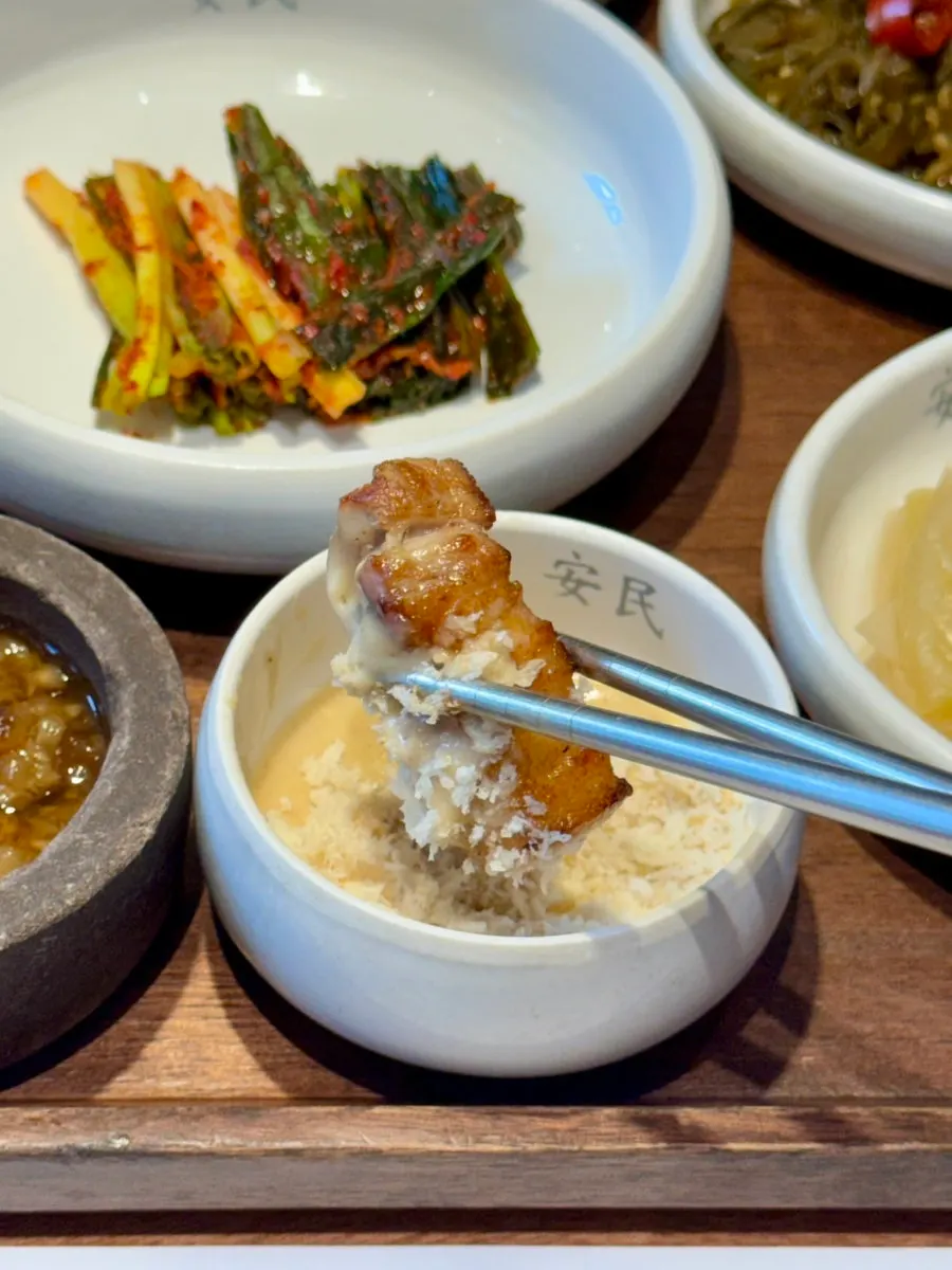 A thick piece of pork neck dipped in pine flower salt