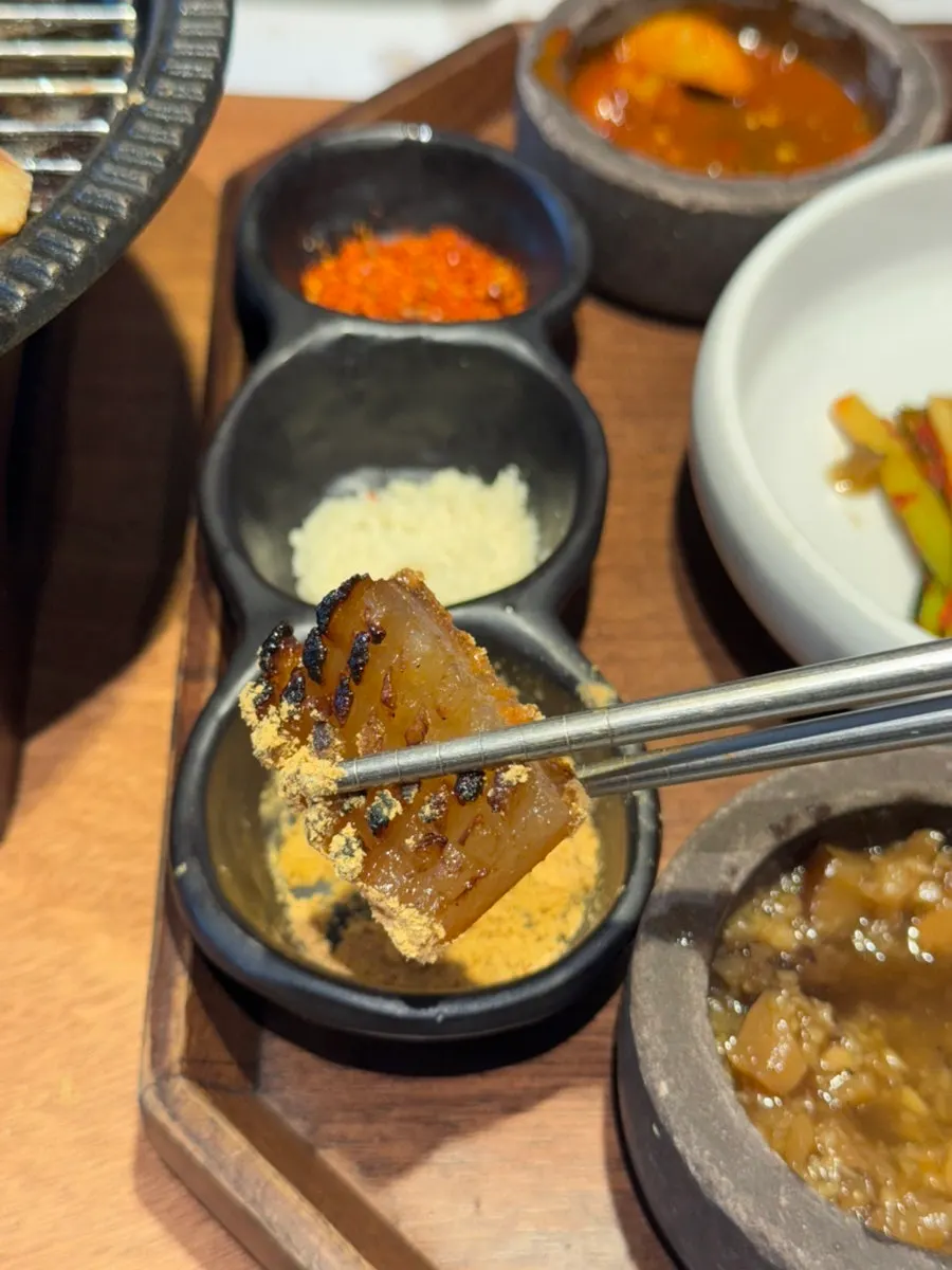 Meat dipped in fish sauce with grilled green onion