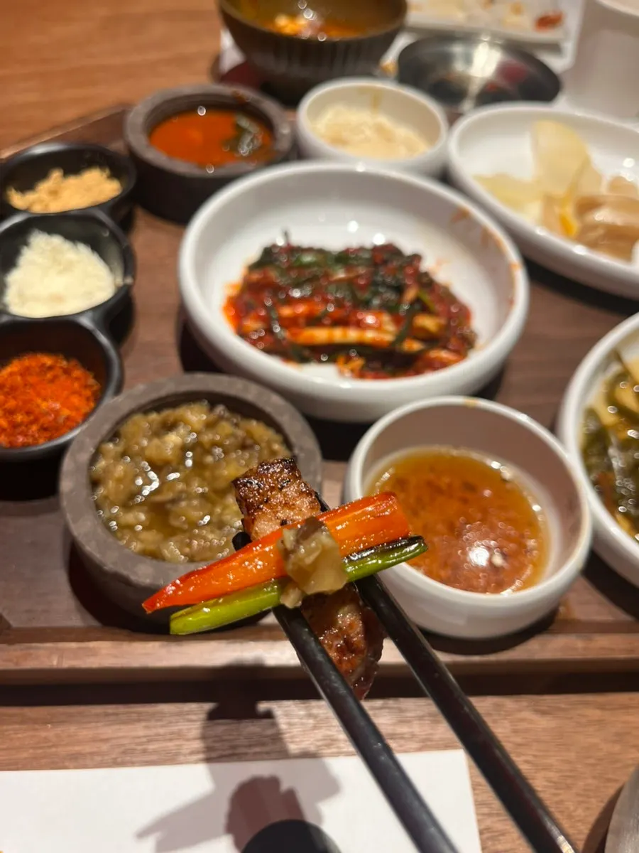 A full spread of grilled meat with vegetables