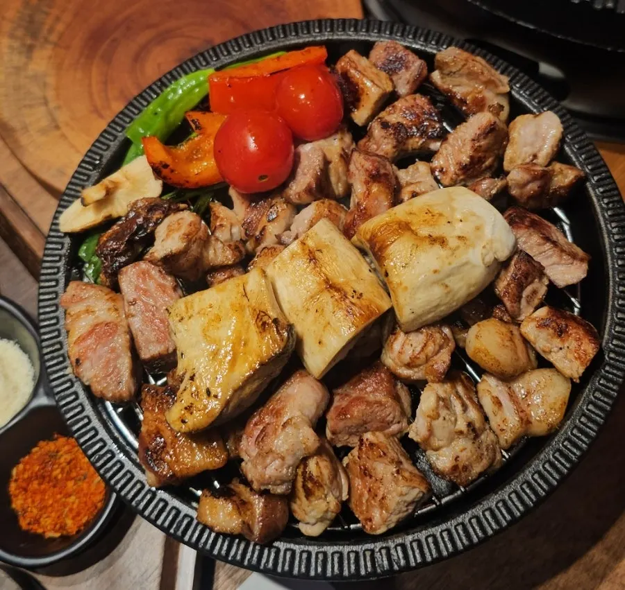 Golden-brown grilled pork neck pieces