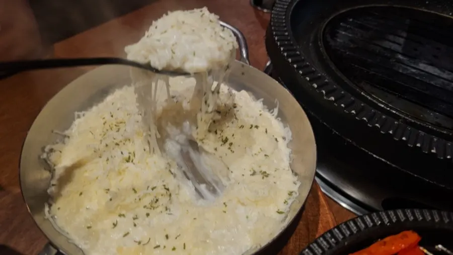 A creamy spoonful of white cheese fried rice
