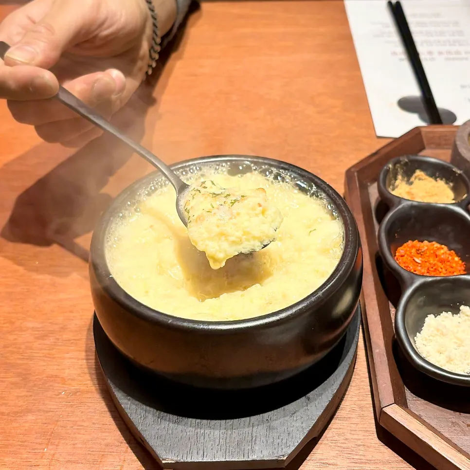 A spoonful cross-section of the steamed egg