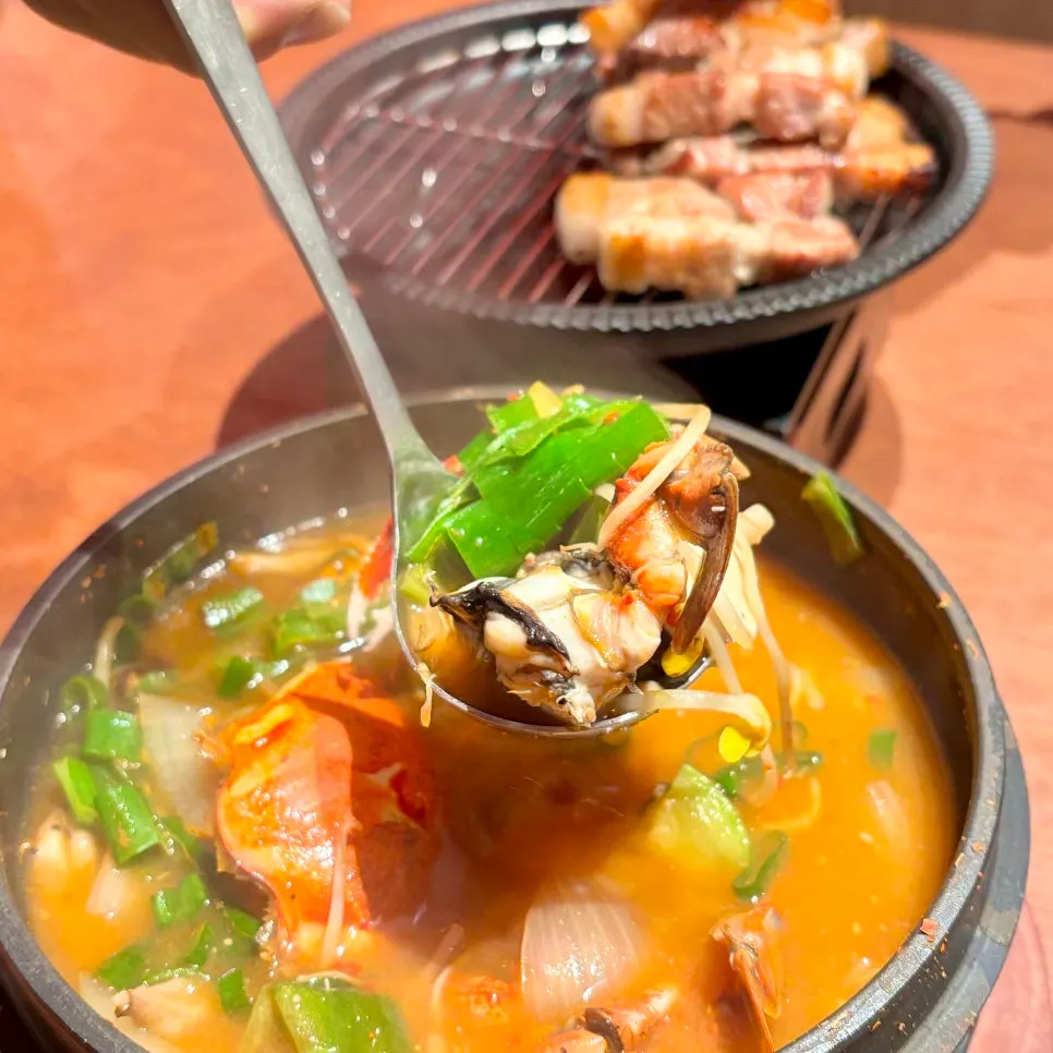Inside the stew, packed with crab and bean sprouts