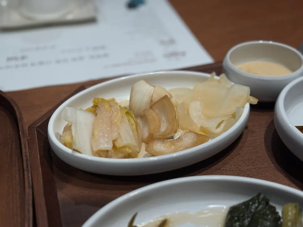 Three kinds of seasonal pickles served as sides