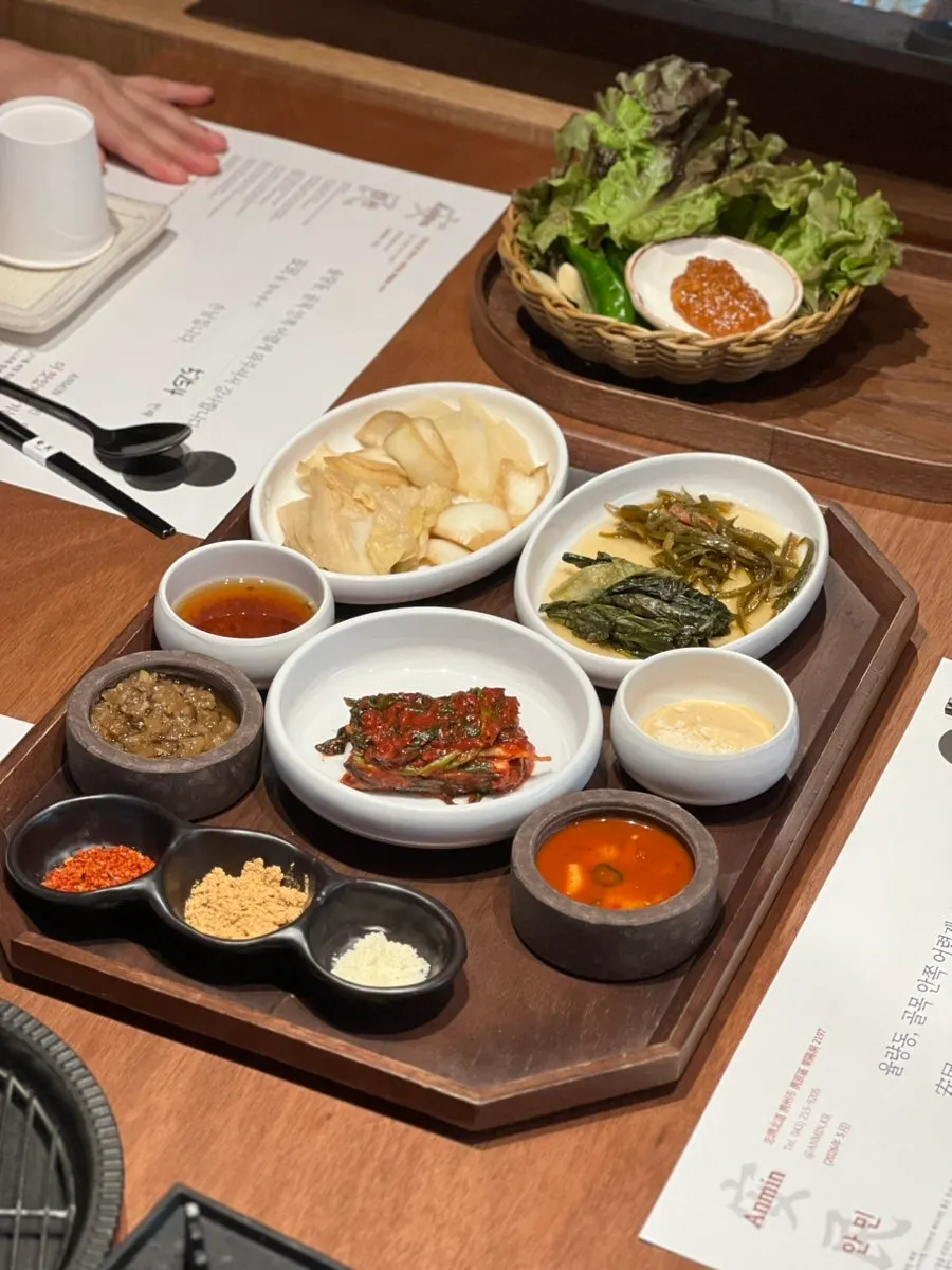 Side dishes and tableware pre-set on the table