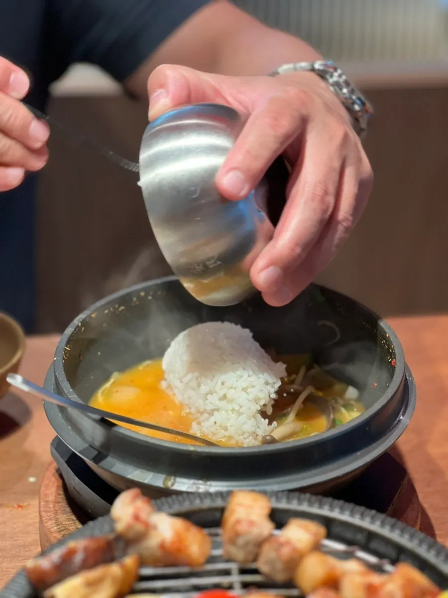 Crab meat and bean sprouts inside the doenjang jjigae