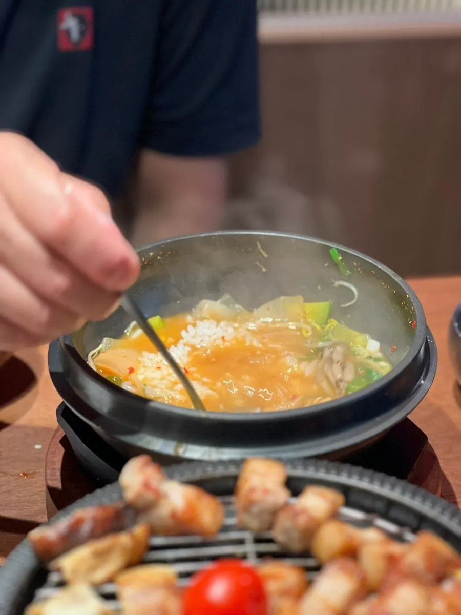 Full table spread of meat and doenjang jjigae