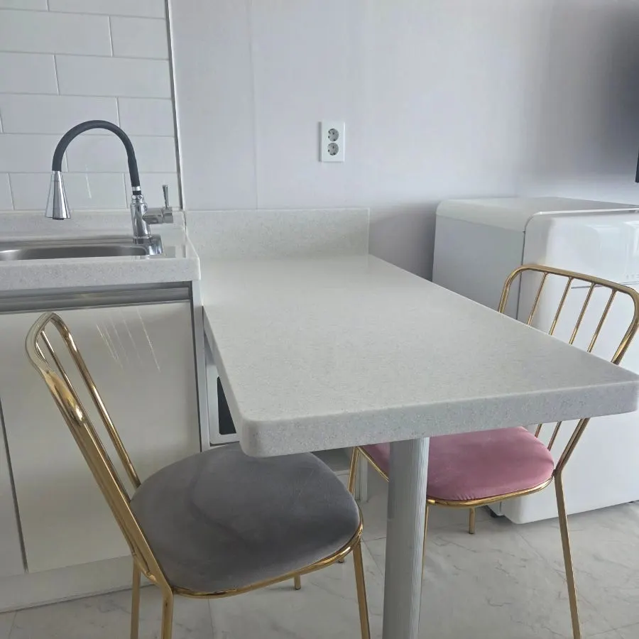 Dining table in the room, sized well for working