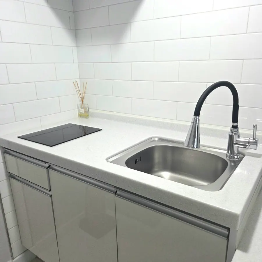 Microwave placed in the room's kitchen