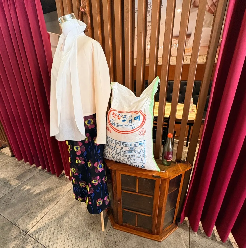 Rice and sesame oil displayed on one side of the restaurant