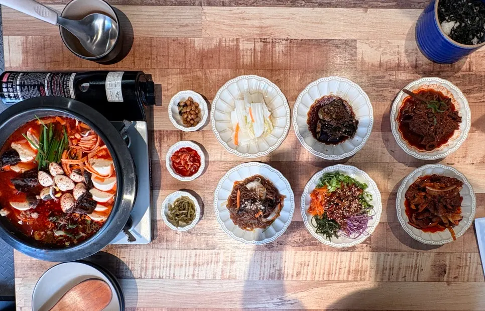 The 10-dish set laid out with hot pot and side dishes