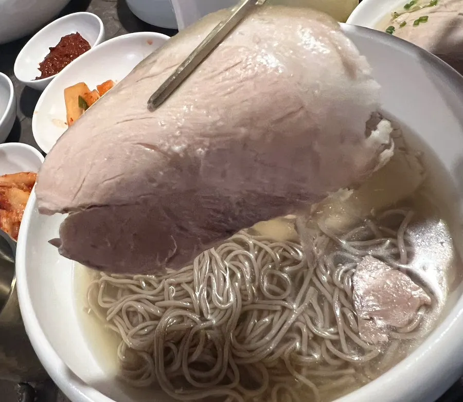 Close-up of the clear broth in the Pyongyang naengmyeon
