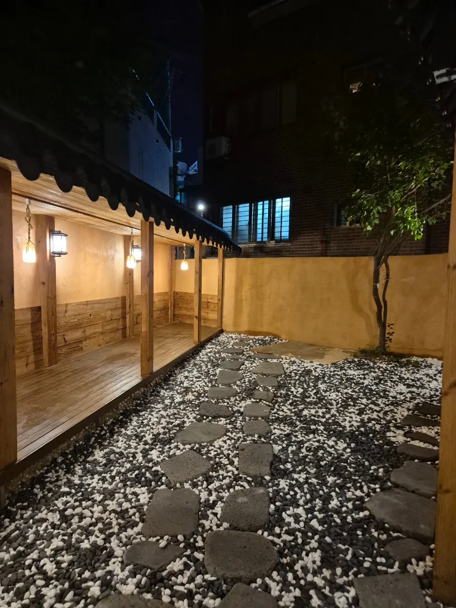 Anok's hanok entrance lit up in the evening