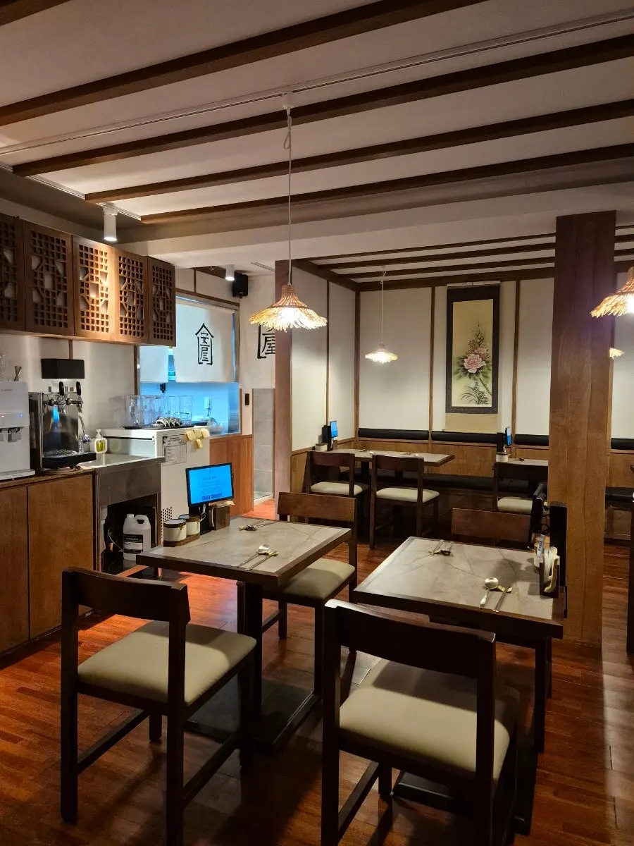 Interior of Anok with wood tones and rafter-style ceiling