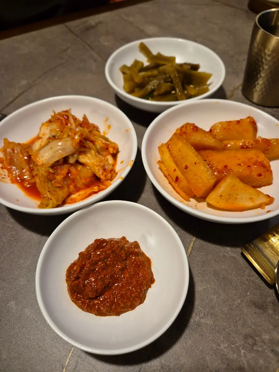 Basic side dishes at Anok — kimchi, kkakdugi, and pickles