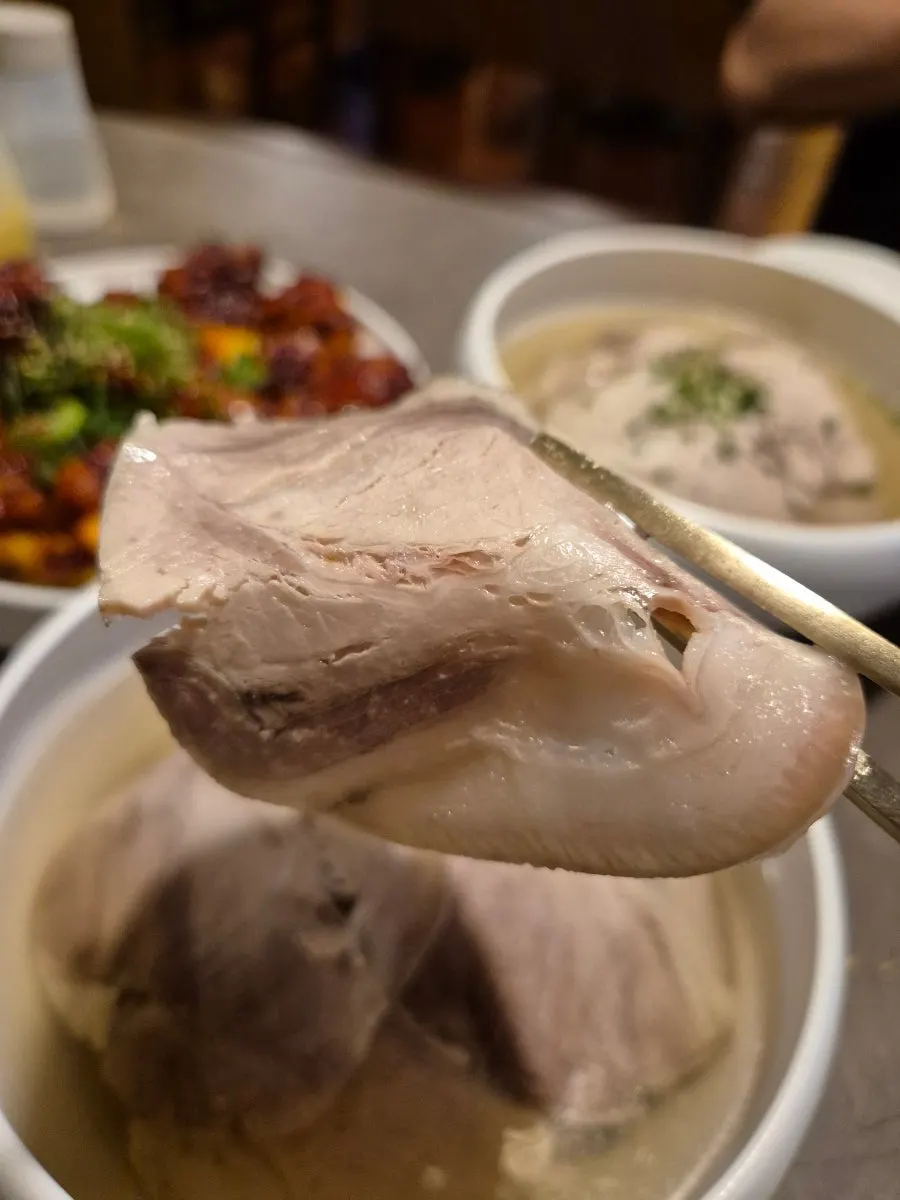 Clear gomtang generously topped with pork