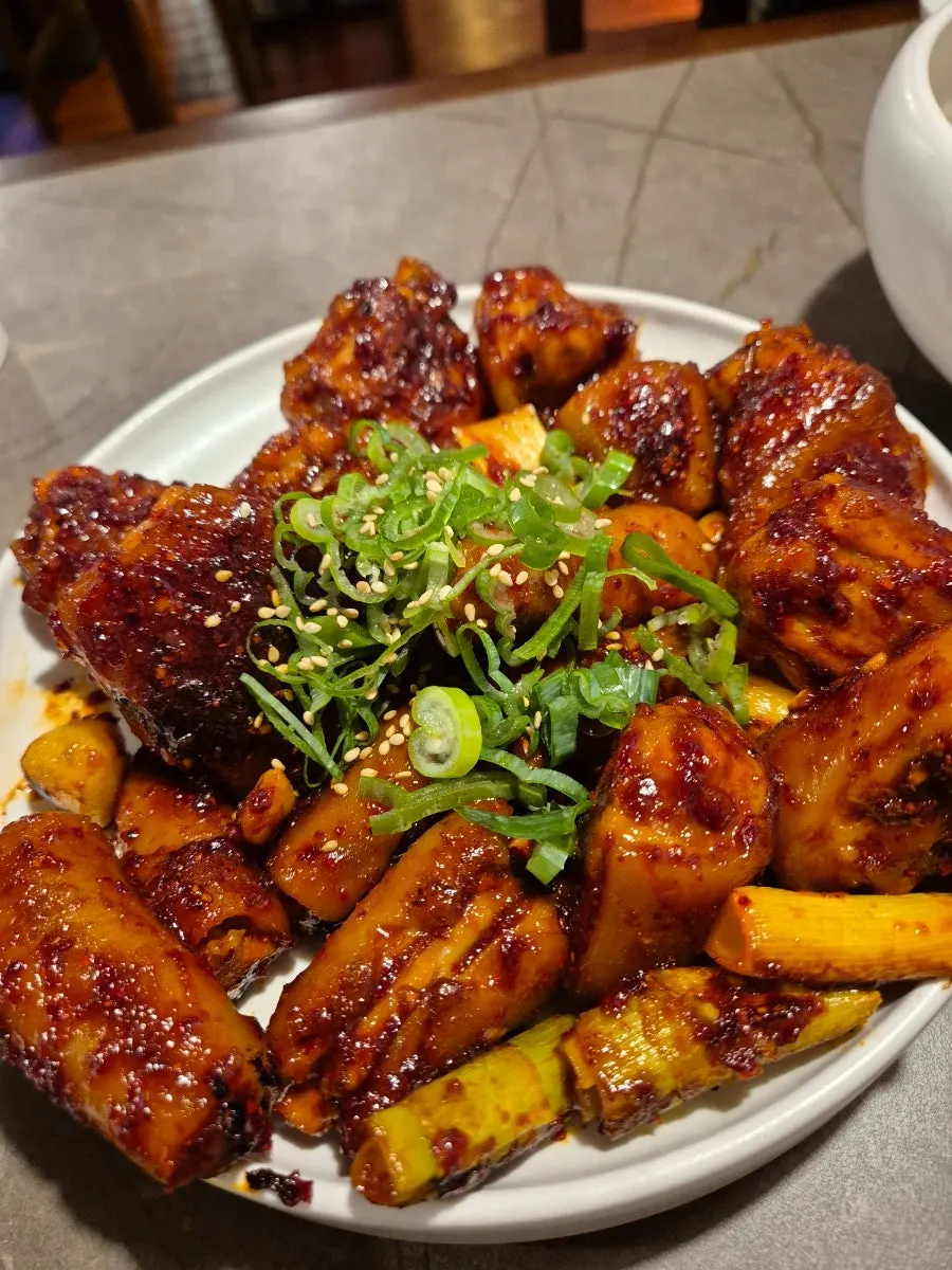 Anok's braised pork tail glazed in glossy red sauce