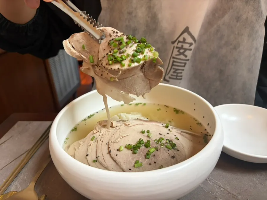 Close-up of the clear pork gomtang with generous meat