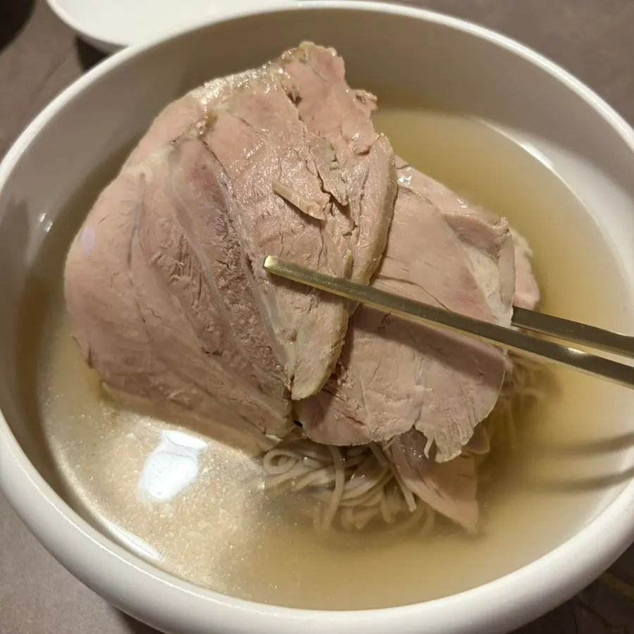A plate of pork tail jjim braised in seasoning
