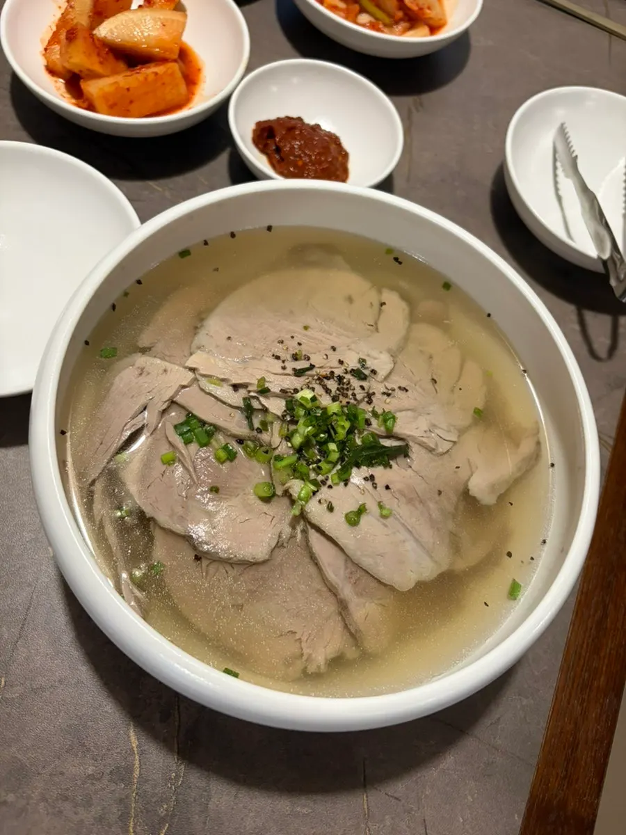A bowl of Anok's Pyongyang naengmyeon topped with meat