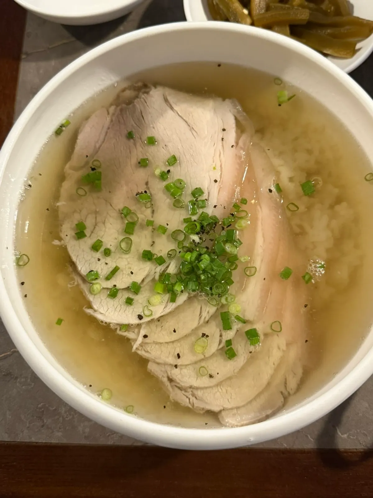 Anok's clear gomtang topped with boiled pork
