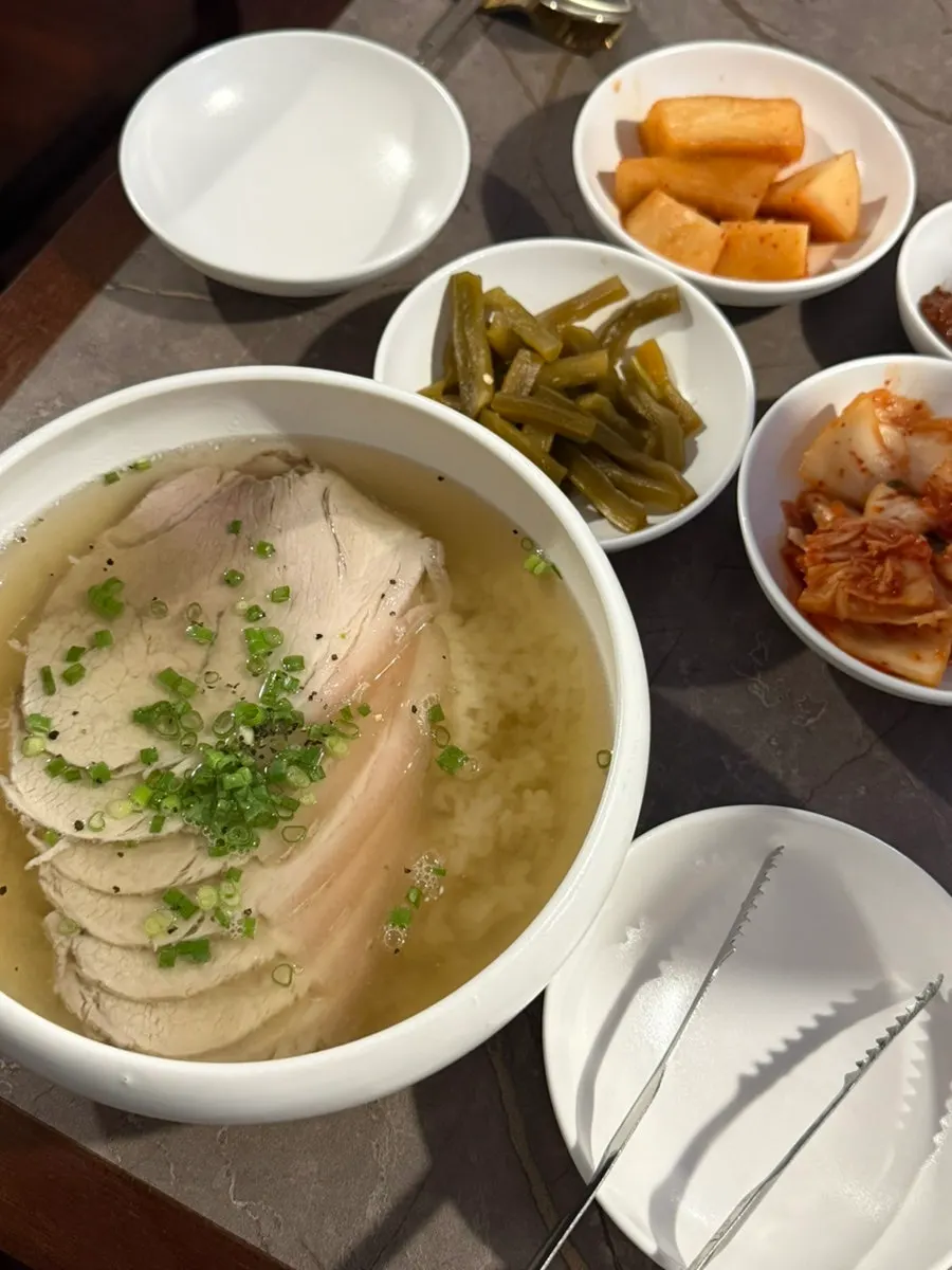 A bowl of gomtang with rice soaked in