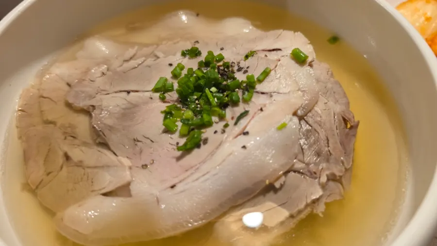 Anok's clear gomtang generously topped with meat