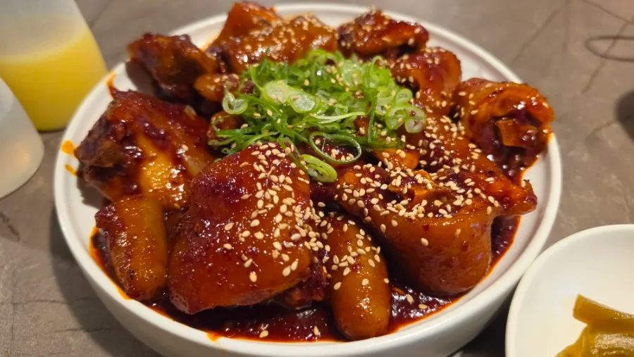 Anok's seasoned braised ox tail topped with sesame seeds and scallions