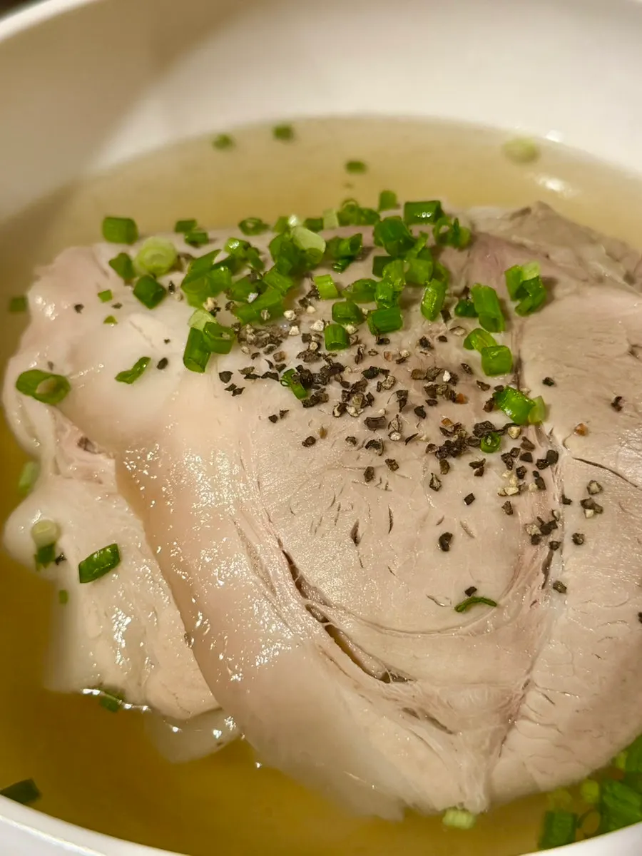 Anok's gomtang topped with meat