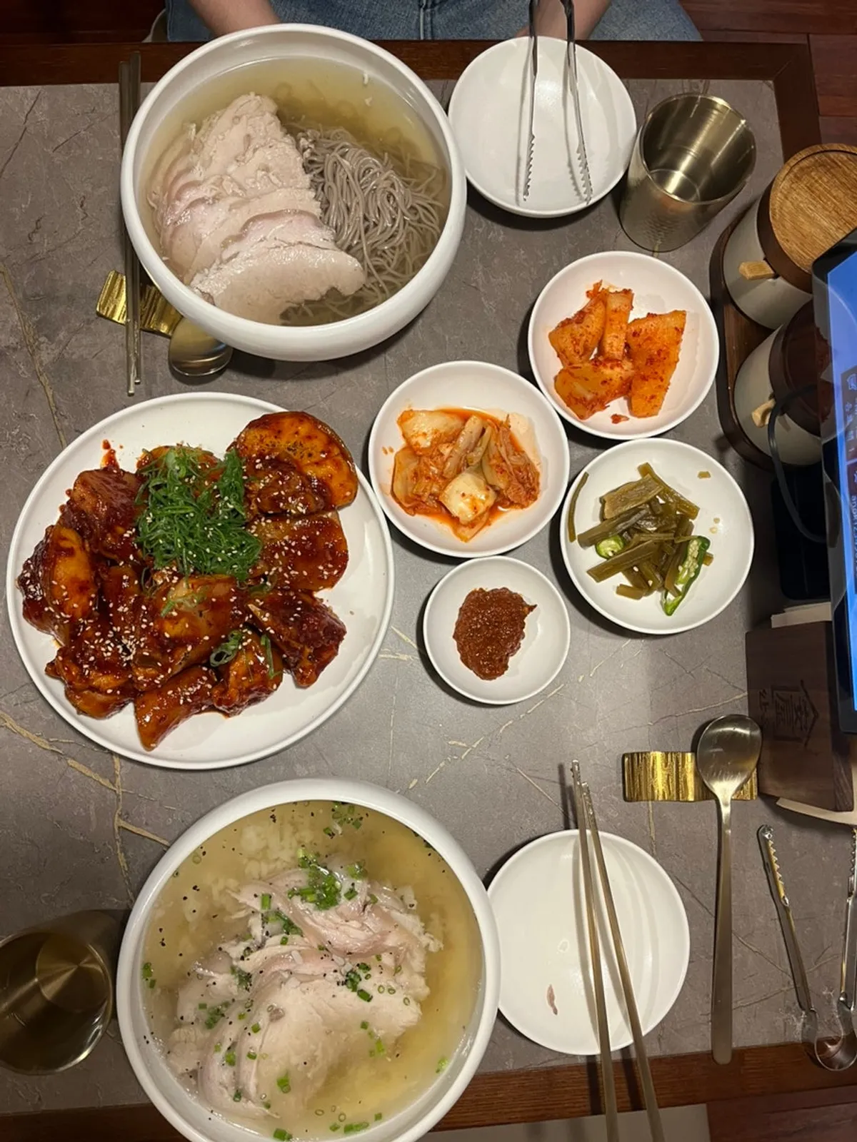 Full spread with pork gomtang, Pyongyang naengmyeon, and pork tail jjim
