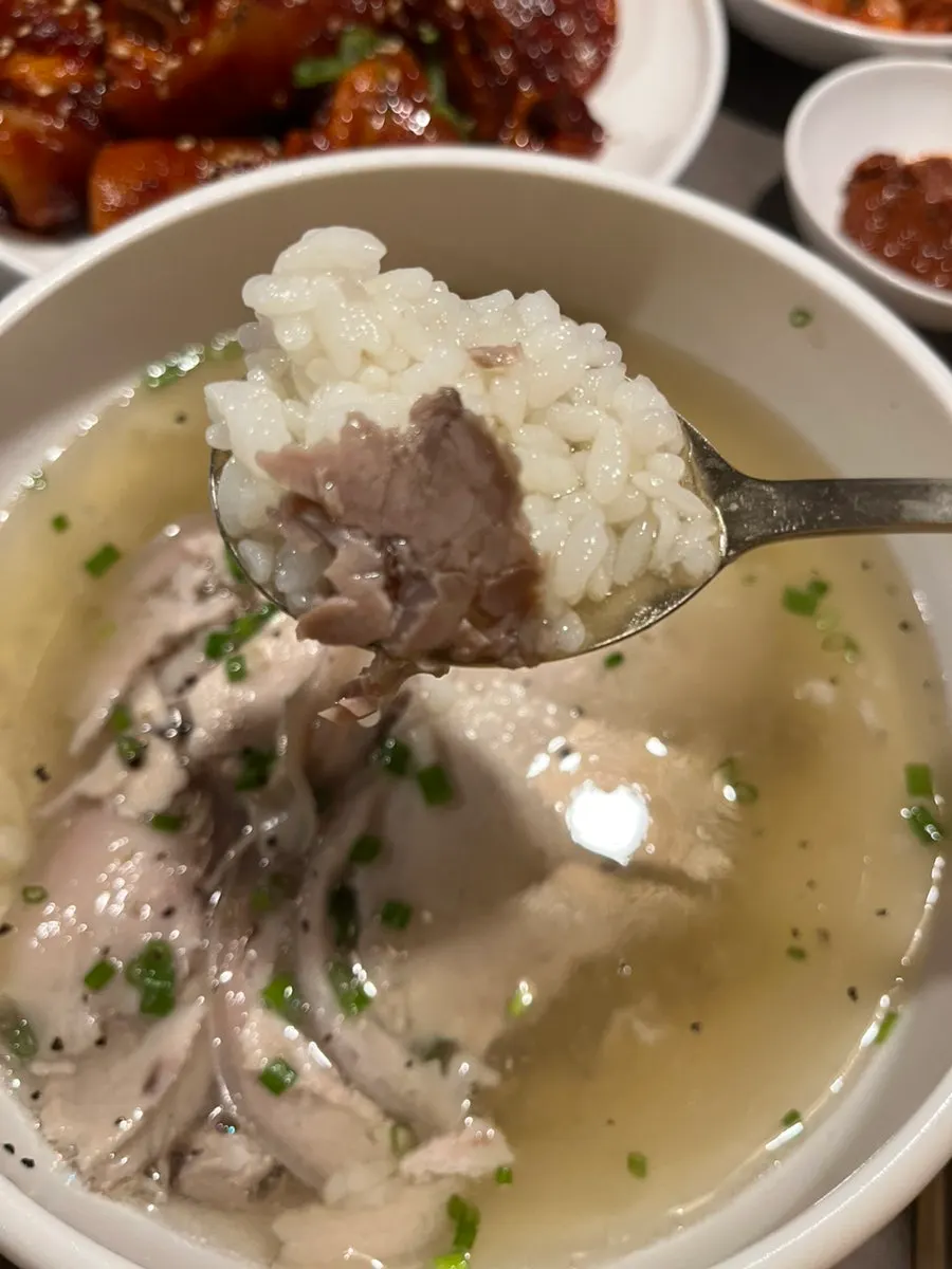 Clear pork gomtang served with rice mixed in