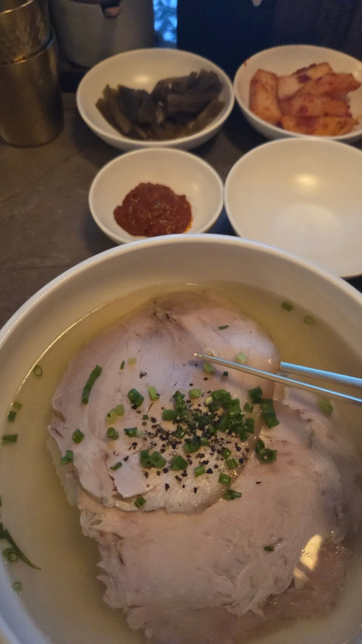 Clear gomtang at Anok topped with Korean-bred pork suyuk