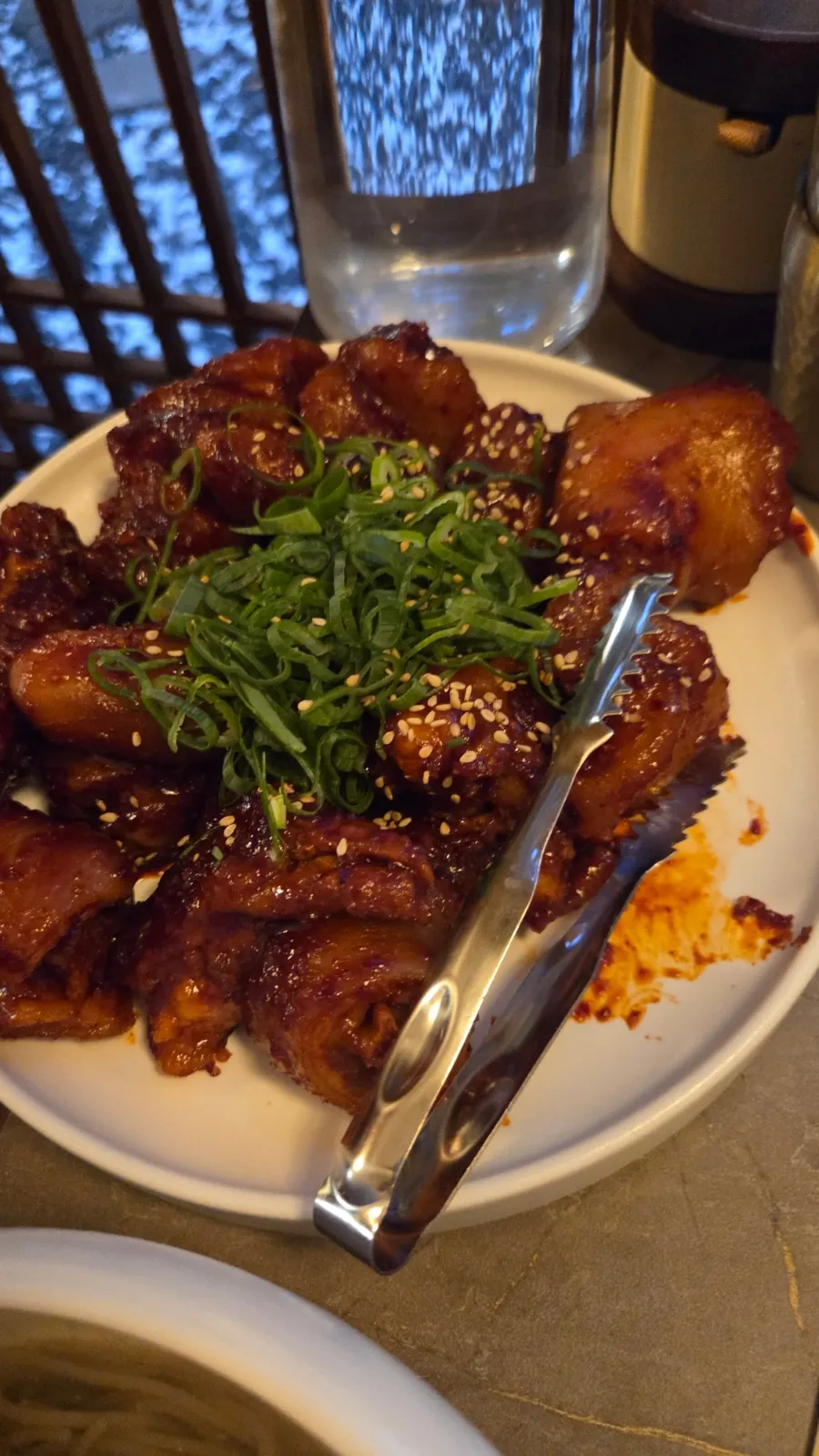 Table setting with gomtang and braised pork tail together
