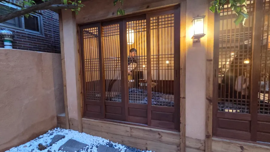 Wide shot of Anok's hanok courtyard
