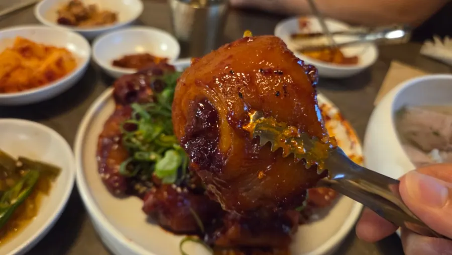 A plate of seasoned steamed pork tail