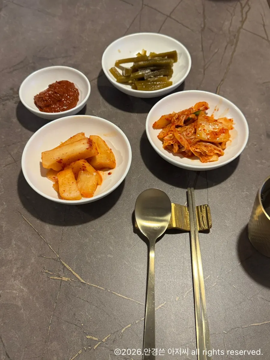 Table setting with kkakdugi and napa cabbage kimchi